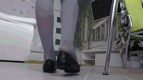 long day at work in tight black flats back view c