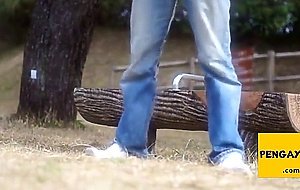 A young gay having a good wank in public