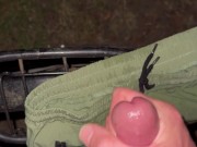 Cumming in park on bike and short