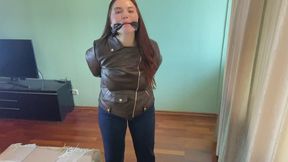 gagged girl in brown leather jacket