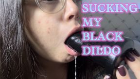 Sucking my black dildo