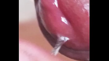 Leaking precum, extreme closeup. July 2, 2024.