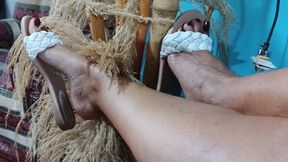 Feet stretched and dangling while tapping the flip-flop with fingertips (3)