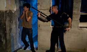 The policeman caught the thief and gave him a lesson