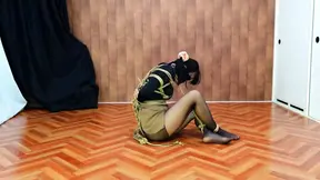 Trapped female endures bondage and vibrator challenge