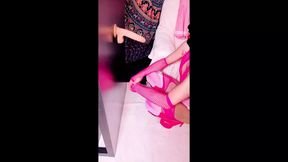 Sissy is deepthroating her dildo dressed in pink, and wearing high heels and chastity cage. Lips painted red the first time.