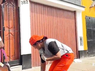 A CHOLONA CLEANING WORKER GETS UP, LIMA-PERU