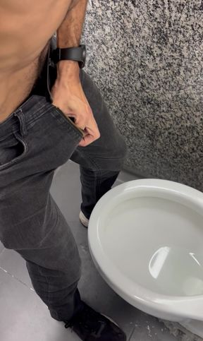 Hairy daddy's thick 9-inch cock exploding in the bathroom freeballing in jeans