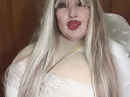 Susi as an sexy angel lying on bed with lush toy