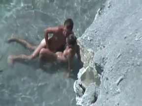 Horny couple fucking passionately on a nudist beach