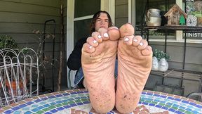 boy shows off his dirty soles