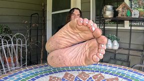 boy shows off his dirty soles