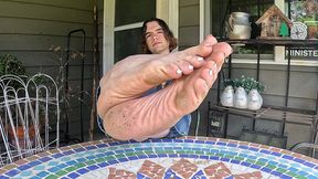 boy shows off his dirty soles