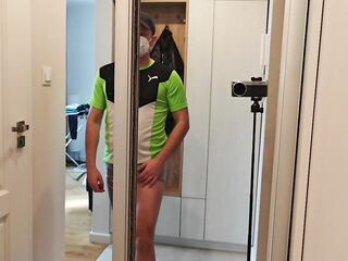 A masked, aroused stud shows off his muscles