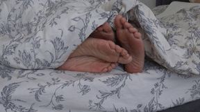 TWO PAIRS OF LEGS UNDER THE BLANKET (fp)