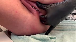 Naughty MILF pierces pussy and wets it with pee