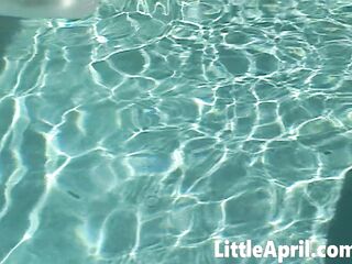 Little April fingers herself in the pool in a POV solo
