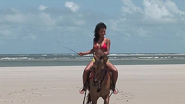 She rides a couple of hard dicks on the beach fucking her in all her holes