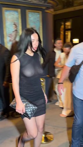 Curvy British celebrity flashes her perky tits in see-through attire