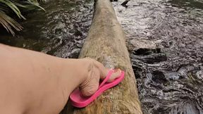 Milah Arches posing her Ipanema Flip Flops in the River