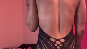 Petite ebony woman in see through black dress