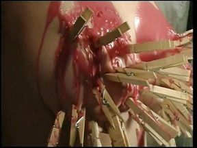 BDSM slut painted and nipples clamped