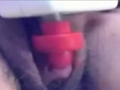 a woman pumps her clit into a dick