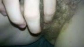 Hairy pussy closeup when she teases herself with fingers
