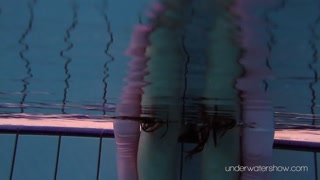 Roxalana Cheh wearing pink dress in the pool
