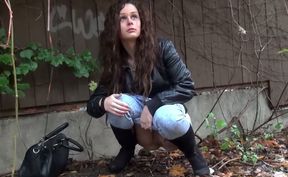 Nice outdoor solo with a lovely long-haired girl peeing