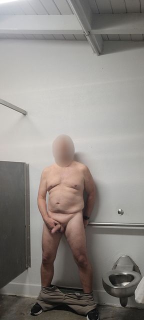Old exhibitionist masturbator stripped and stroking in men's room stall