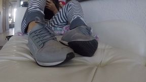 Home from the gym, relaxing on the sofa in sweaty sneakers and no socks SHOE FETISH