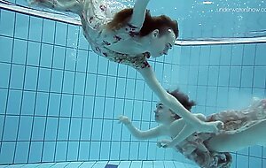 Two hot hairy beauties underwater
