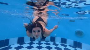 Swimming and blowing bubbles underwater