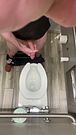 Big Dick Daddy stands up from the toilet to finish jerking off his penis and squirts his fresh cum