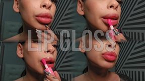 Painting my lips with gloss