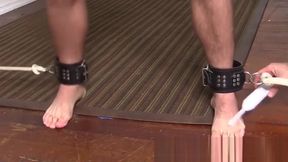 Ticklish guy is bound with his arms up with his pits exposed