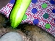 Inserting huge cucumber in asshole