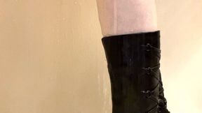 Close up of my black leather boots getting wet in the shower