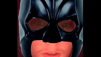 Young Batman stares at camera