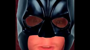 Young Batman stares at camera