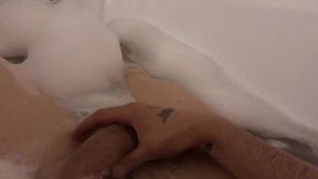 The stud milks off taking a tub with foam