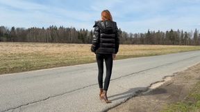 A girl in leopard shoes and nylon stockings walks on a muddy road and gets her feet dirty