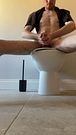 Solitary male climax in empty bathroom lights