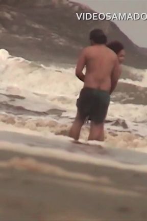 Shameless couple has sex in the shallow sea