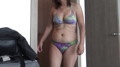 My wife, a Latin mother, exhibits herself on the beach and masturbates in front of the hotel owner,