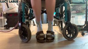 footcam under her editing desk socks sandals and toes