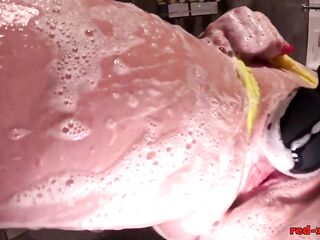 Red XXX gets all soaped up in the shower