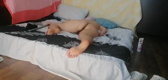 Sensual massage of a steamy couple with oil on the body. Foreplay in the bedroom with an amateur couple.