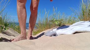 I&#039;m sunbathing in the dunes. I see a man standing next to me watching me, I spread my legs and show my cock.